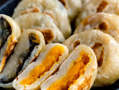 Stuffed with sweet kabocha squash and miso-glazed eggplant, these Oyaki Japanese dumplings are a popular snack in Nagano Prefecture in central Japan.