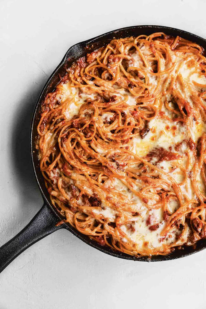 This cheesy baked spaghetti, made with pasta, tomatoes, ground beef or Italian sausage, mozzarella, and Pecorino Romano is a true one-pan wonder that will satisfy even the pickiest eaters at your table.