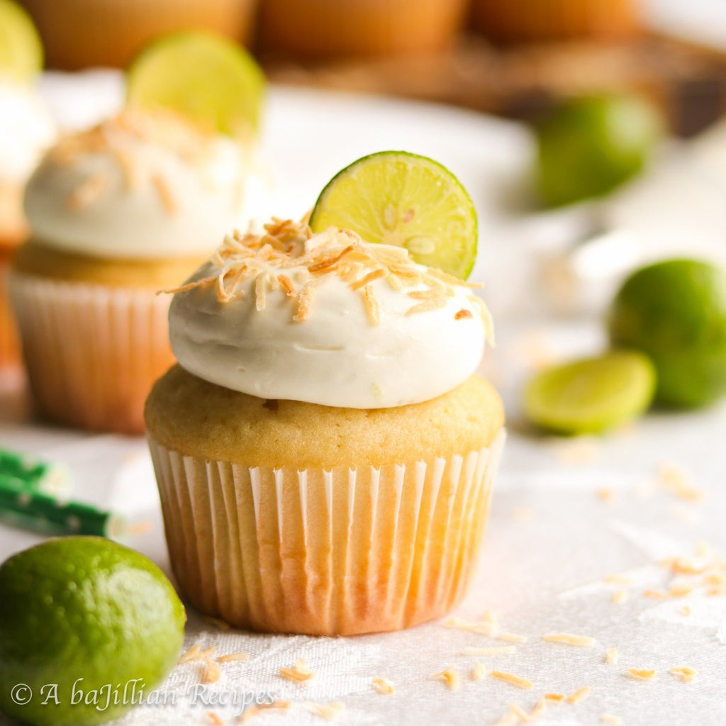 Fluffy coconut cupcakes topped with a tart and tangy key lime frosting!